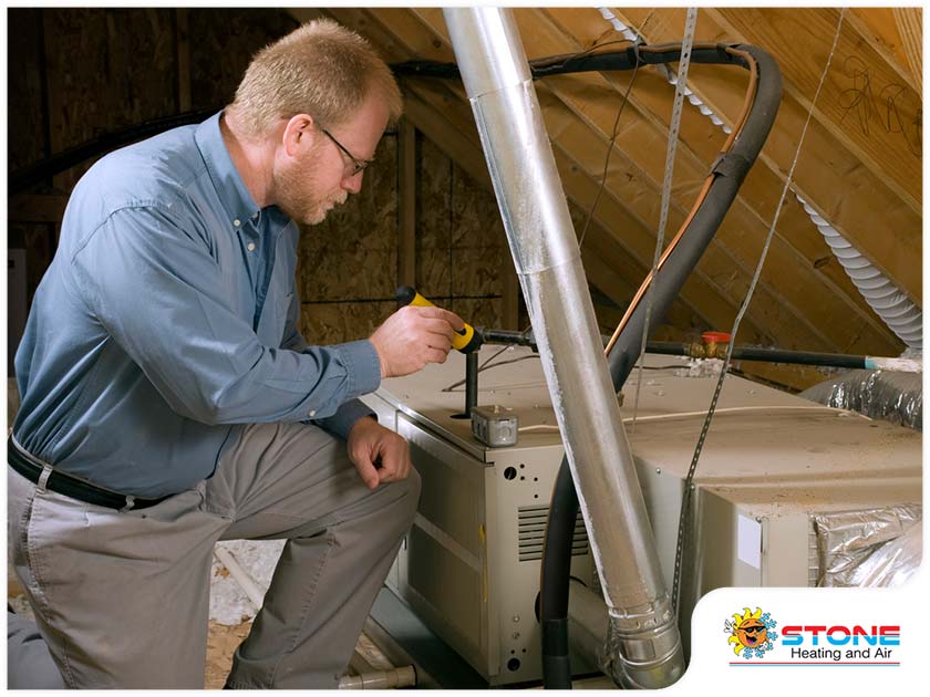 4176-1612832572-home-heating-repair-contractor-inspecting-a-furnace.jpg
